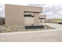 Gorgeous desert home with modern architecture and xeriscaped front yard at 37200 N Cave Creek Rd # 1013, Scottsdale, AZ 85262