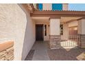Welcoming front porch with stone accents, leading to the front door at 4347 W Darrel Rd, Laveen, AZ 85339