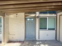 Inviting entryway with a gray front door, tiled entry and ample sunlight at 555 N May -- # 1, Mesa, AZ 85201