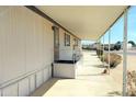 Inviting covered entry with a well-maintained walkway and mature landscaping at 649 S 87Th Way, Mesa, AZ 85208