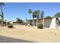 Single-story home featuring neutral siding, a covered entry, and mature landscaping in a well-maintained community at 649 S 87Th Way, Mesa, AZ 85208