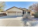 Inviting single-story home with a spacious three-car garage and desert-friendly landscaping at 809 S 120Th Ave, Avondale, AZ 85323
