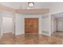 Spacious foyer with tile flooring and double entry doors offering a grand welcome at 9204 N 106Th Way, Scottsdale, AZ 85258