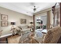 Comfortable living room with a ceiling fan, patterned seating, and access to a patio at 945 E Playa Del Norte Dr # 1003, Tempe, AZ 85288