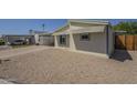 Charming home with a carport, low-maintenance landscaping and neutral tones at 10951 N 91St Ave # 32, Peoria, AZ 85345