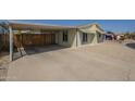 Inviting home with a convenient carport and easy-care gravel landscaping at 10951 N 91St Ave # 32, Peoria, AZ 85345
