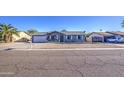 Beautiful single-story home with gravel landscaping, a garage and a well-kept lawn at 1529 W Wickieup Ln, Phoenix, AZ 85027