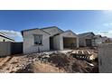New single-story home with stucco exterior, tile roof and open garage at 15773 W Beryl Ave, Waddell, AZ 85355
