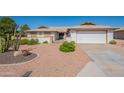 Charming single-story home showcasing desert landscaping and a convenient two-car garage at 1871 Leisure World --, Mesa, AZ 85206