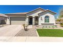 Charming single-story home featuring a well-maintained front yard, paved driveway, and attached garage at 19038 N Arbor Dr, Maricopa, AZ 85138