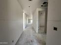 Unfinished hallway showcasing the spacious layout of the home under construction at 22812 E Lords Way, Queen Creek, AZ 85142