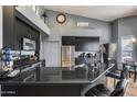 Stylish kitchen features a stainless steel refrigerator, gas stovetop, and a wine refrigerator at 29023 N 48Th Ct, Cave Creek, AZ 85331