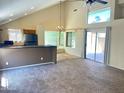 Living room showcasing abundant natural light, a ceiling fan, and a seamless flow into the dining area at 3877 W Butler St, Chandler, AZ 85226