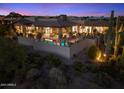 This home has a backyard featuring a pool, a patio, and desert landscaping at 39254 N 104Th Pl, Scottsdale, AZ 85262