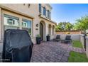 Private brick-paved patio with lounge chairs, perfect for relaxation and outdoor entertainment at 4077 S Sabrina Dr # 14, Chandler, AZ 85248