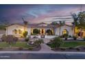 Stunning single-story home with lush landscaping, paver walkway, and barrel tile roof at 4547 S Banning Dr, Gilbert, AZ 85297