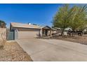 Single-story home with an extended driveway and a two-car garage at 5423 S Palm Dr, Tempe, AZ 85283