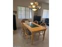 Eat in kitchen with natural light and a dining table with four chairs at 7609 E Indian Bend Rd # 1012, Scottsdale, AZ 85250