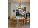 Eat in kitchen with views of the kitchen, dining table with seating for six, and tile flooring at 7609 E Indian Bend Rd # 1012, Scottsdale, AZ 85250
