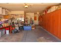 Spacious garage interior featuring ample storage and built-in cabinetry at 10603 W Ruth Ave, Peoria, AZ 85345