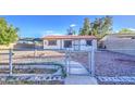 The backyard has decorative rock landscaping and block fence at 10917 W Apache St, Avondale, AZ 85323