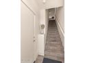 A carpeted stairwell with white walls leads to the upper level of the home at 1851 E Frye Rd # 101, Gilbert, AZ 85295