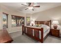 Relaxing main bedroom featuring a ceiling fan, neutral decor, and comfortable furnishing at 20555 N 261St Ave, Buckeye, AZ 85396