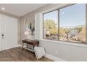 Bright foyer with a window, desk, and decor creates a welcoming first impression at 20801 N 90Th Pl # 169, Scottsdale, AZ 85255