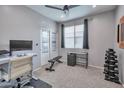 Functional home office with weights, exercise equipment, and a bright window at 2210 W Goldmine Mountain Dr, Queen Creek, AZ 85144
