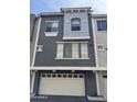 Stylish townhome featuring multi-tone exterior and well-lit two-car garage at 2402 E 5Th St # 1428, Tempe, AZ 85288
