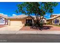 Inviting single-Gathering home with a well-maintained front yard and attached two-car garage at 3140 N 114Th Dr, Avondale, AZ 85392