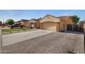 Charming single-Gathering home featuring a two-car garage and a brick paver driveway at 3592 E Sandwick Dr, San Tan Valley, AZ 85140