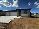 New construction home featuring a three-car garage and modern architectural details at 4344 E Brook Lynn Pl, San Tan Valley, AZ 85140