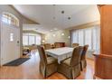 This dining room features a chandelier, hardwood floors, natural light and plenty of room for entertaining at 5674 W North Ln, Glendale, AZ 85302