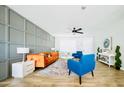 Stylish living room featuring a colorful rug, hardwood floors and bright decor at 5929 S Lakeshore Dr, Tempe, AZ 85283