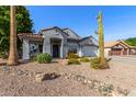 Attractive single-story home with mature landscaping, desert plants and xeriscaping at 7908 W Rose Garden Ln, Peoria, AZ 85382