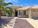 Charming single-Gathering home featuring desert landscaping with a walkway leading to the front door at 8535 W Willow Ave, Peoria, AZ 85381
