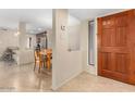 Inviting entryway with direct view of dining area and modern kitchen at 9340 N 92Nd St # 120, Scottsdale, AZ 85258