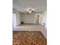 Spacious living room with neutral walls, tiled floors, ceiling fan, and natural light at 11038 N 53Rd Dr, Glendale, AZ 85304