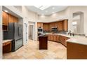 Spacious kitchen featuring stainless steel appliances, tile backsplash, and a center island at 16211 S 4Th St, Phoenix, AZ 85048