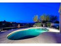 Backyard pool and desert landscaping at dusk at 16304 E Crystal Ridge Dr, Fountain Hills, AZ 85268