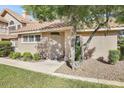 Inviting home exterior with lush landscaping, sidewalk and well maintained facade at 1633 E Lakeside Dr # 139, Gilbert, AZ 85234