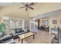 Spacious living room with high ceilings, tile flooring, and comfortable seating arrangement at 1633 E Lakeside Dr # 139, Gilbert, AZ 85234