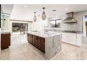 Modern kitchen with granite countertops, stainless steel appliances, and a large center island for entertaining at 22633 N Clubhouse Way, Scottsdale, AZ 85255