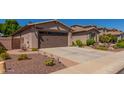 Home featuring a two-car garage, desert landscaping, and brick-paver accents at 2680 E Lodgepole Dr, Gilbert, AZ 85298