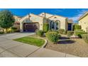 Inviting single-story home with a well-maintained front yard, featuring a two-car garage and appealing landscaping at 3566 S Colorado St, Chandler, AZ 85286