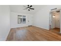 Spacious living room with hardwood flooring, ceiling fan, and great natural light at 3646 N 69Th Ave # 55, Phoenix, AZ 85033