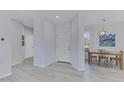 Bright foyer with an interior white front door and dining room with natural light at 3843 E Hazeltine Way, Chandler, AZ 85249
