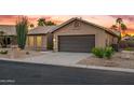 Lovely single-story home with desert landscaping and an attached two-car garage at 4020 N 151St Dr, Goodyear, AZ 85395
