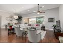 Cozy living room with hardwood floors, large sofa, and stylish accent chairs perfect for entertaining at 6125 E Hodges St, Cave Creek, AZ 85331